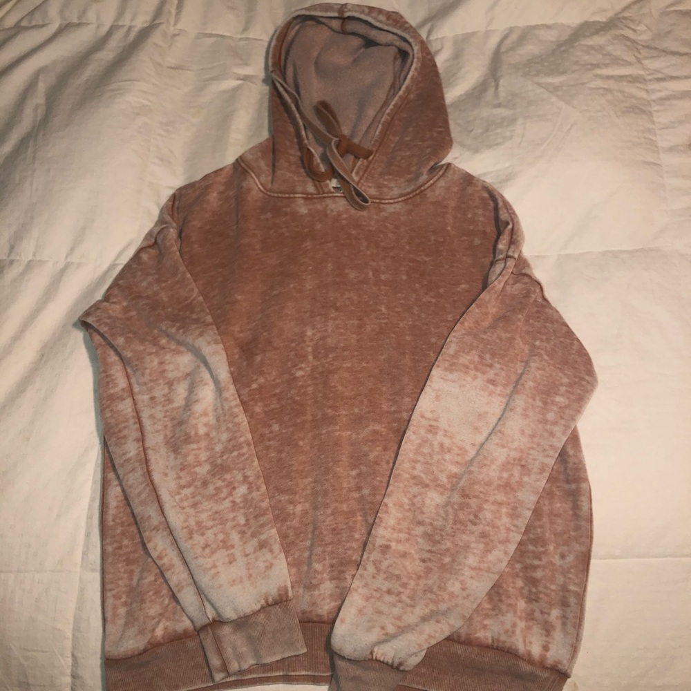 Washed out peach colored sweatshirt